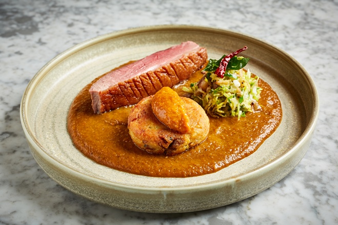 Goose vindaloo with confit leg aloo tiki, sprout and chestnut thoran and apple achaar