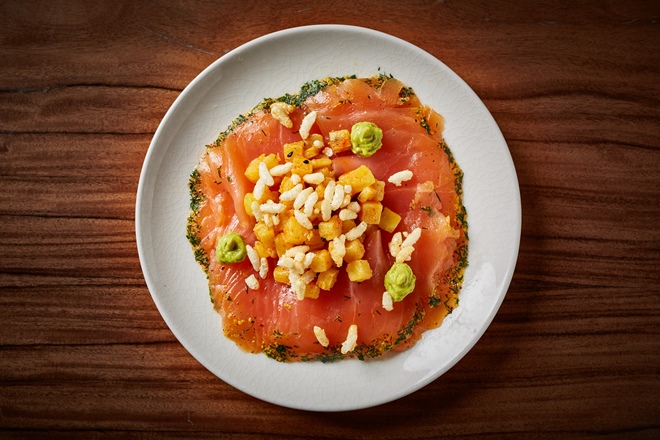 Salmon carpaccio with caramel jhal muri and green pea relish